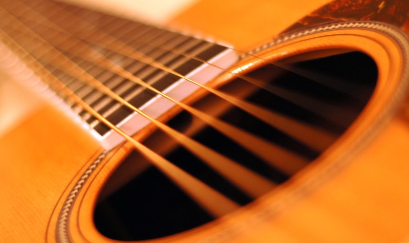 Closeup photo of an acoustic guitar's sound hole