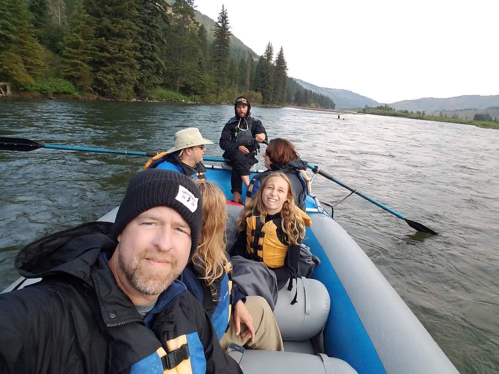 Photo of Paul Wolke on a boat in a river